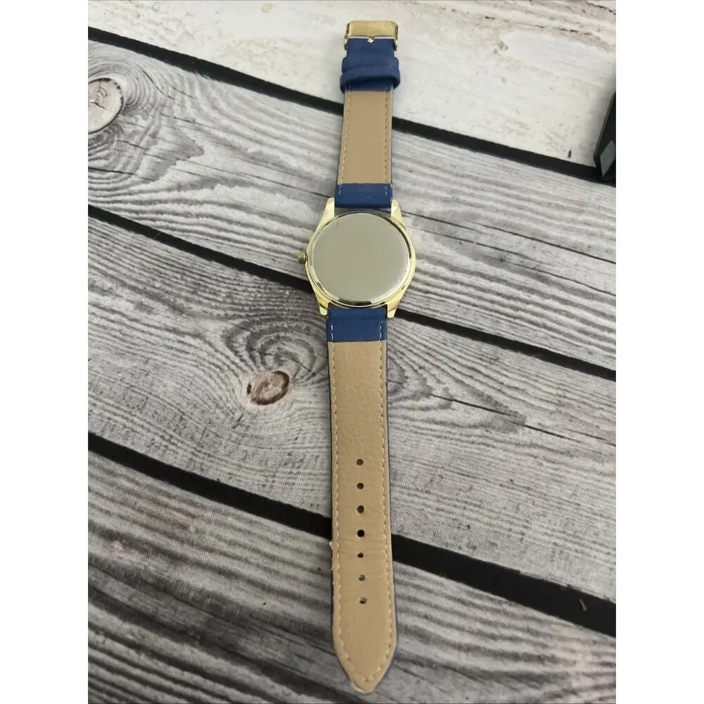 Gold Tone Case Purple Dial Blue Band Women’s Quartz Watch